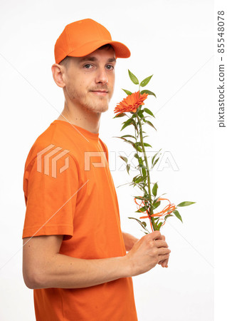 Young man with flower on white Young man with flower on white 85548078