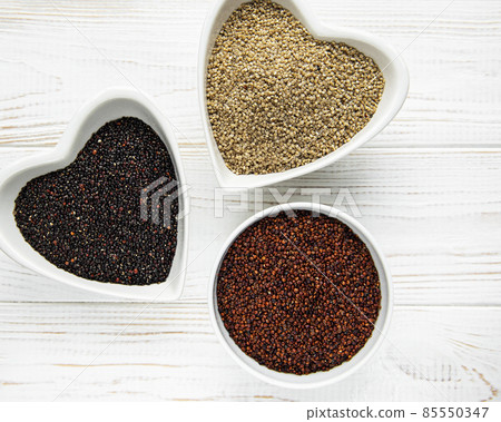 Red, black and white quinoa seeds 85550347