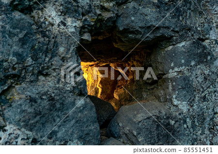 embrasure in the old fortress wall through which light breaks, close-up embrasure in the old fortress wall through which light breaks, close-up 85551451
