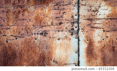 Rusty metal background, scratches stains rivets and seams on textured iron wall Rusty metal background, scratches stains rivets and seams on textured iron wall 85552209