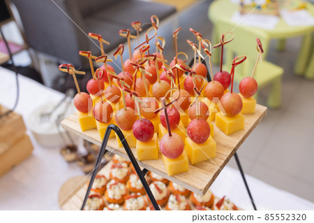 Different types of canapes on buffet table. Different types of canapes on buffet table. 85552320