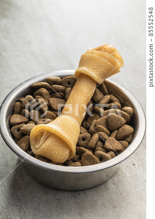 Delicacy for dogs. Chewing bone and dried food for dog Delicacy for dogs. Chewing bone and dried food for dog 85552548