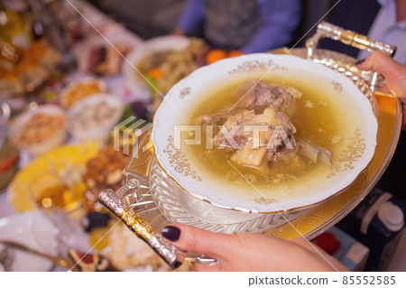 Delicious beef broth, a traditional dish made with beef bone and vegetables. Delicious beef broth, a traditional dish made with beef bone and vegetables. 85552585