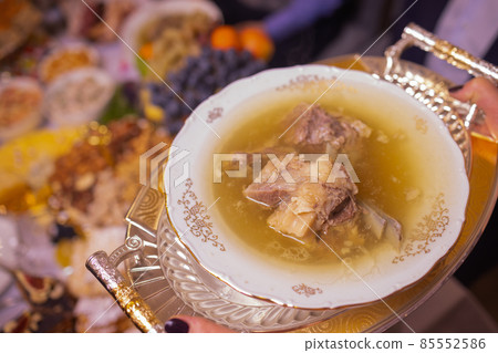 Delicious beef broth, a traditional dish made with beef bone and vegetables. Delicious beef broth, a traditional dish made with beef bone and vegetables. 85552586