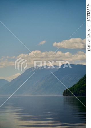 View of lake Teletskoye and the surrounding mountains from the village of Artybash. Turochaksky district, Altai Republic, South of Western Siberia, Russia. 85552899