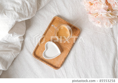 Valentine day lifestyle composition. Still life Mockup scene with plate and cup of coffee. Breakfast in bed. Linen background. Flat lay, top view 85553258