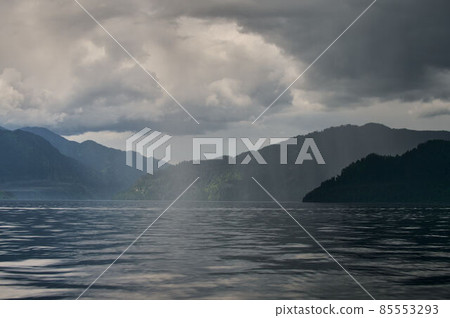Fog in the mountain valley. Morning fog over the lake in the Altai mountains. Fog in the mountain valley. Morning fog over the lake in the Altai mountains. 85553293