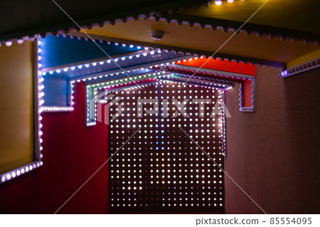 Many light bulbs, beautifully shine on the building in the evening 85554095