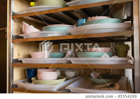 Tray cart with dirty dishes in a gastronomic operation. 85554209