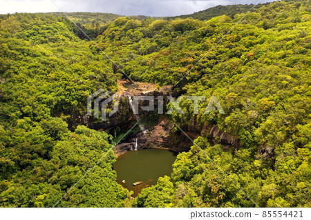 Aerial view from above of the Tamarin waterfall seven cascades in the tropical jungles of the island of Mauritius Aerial view from above of the Tamarin waterfall seven cascades in the tropical jungles of the island of Mauritius 85554421
