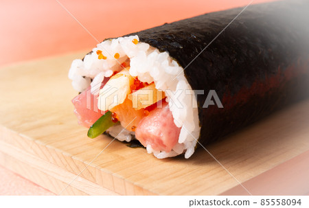 Thick sushi rolls on a cutting board, Ehomaki sushi rolls, thick sushi rolls Thick sushi rolls on a cutting board, Ehomaki sushi rolls, thick sushi rolls 85558094