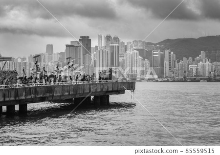 People view the Iconic Hong Kong city skyline from Tsim Sha Tsui Promenade 85559515