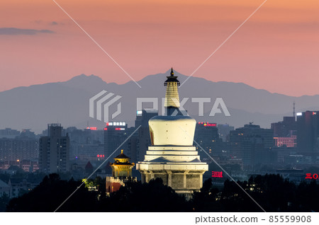 Sunset view of White Pagoda in Beihai park and Beijing skyline, China Sunset view of White Pagoda in Beihai park and Beijing skyline, China 85559908