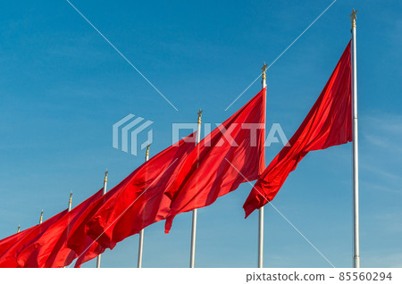 Red banners unfurled in the wind at Tiananmen square in Beijing, China 85560294