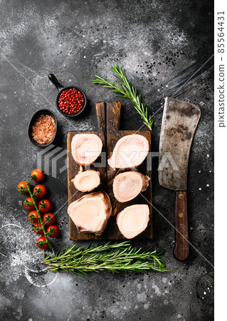 Raw beef marrow bones, on black dark stone table background, top view flat lay 85564431