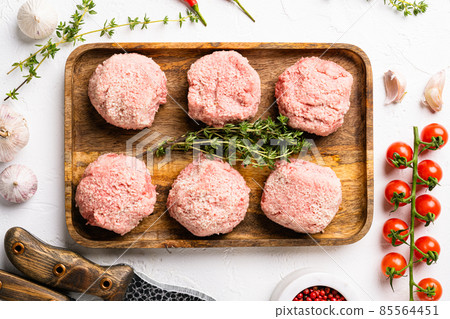 Organic minced meat meatball, on white stone table background, top view flat lay Organic minced meat meatball, on white stone table background, top view flat lay 85564451