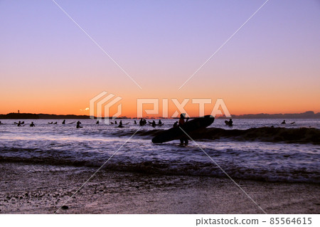 First sunrise surfing (silhouette) First sunrise surfing (silhouette) 85564615