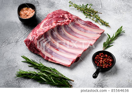 Frenched rack of lamb Mutton, on gray stone table background 85564636