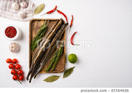 Grilled lamprey , on white stone table background, top view flat lay, with copy space for text 85564686