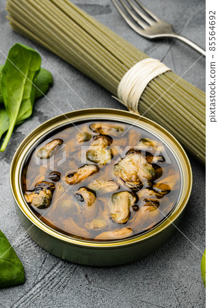 Uncooked Pasta Spaghetti alle Vongole Seafood pasta ingredients, on gray stone table background Uncooked Pasta Spaghetti alle Vongole Seafood pasta ingredients, on gray stone table background 85564692
