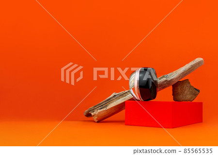 Cosmetic face BB cream tonal foundation glass jar mockup natural wood podium orange background. Balancing makeup product Cosmetic face BB cream tonal foundation glass jar mockup natural wood podium orange background. Balancing makeup product 85565535