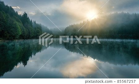 Beautiful scenic view of Savsat Karagol Black lake in Eastern Black Sea region with morning evaporation. Savsat Karagol lake is a large trout lake in the forest in Artvin, Turkey Beautiful scenic view of Savsat Karagol Black lake in Eastern Black Sea region with morning evaporation. Savsat Karagol lake is a large trout lake in the forest in Artvin, Turkey 85567257