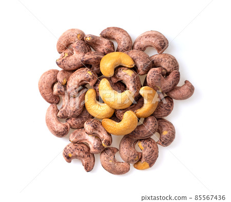 Roasted cashew nuts isolated on white background Roasted cashew nuts isolated on white background 85567436