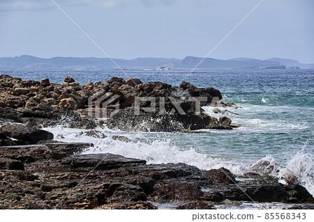 Rocks on the shore hit by the wave Rocks on the shore hit by the wave 85568343