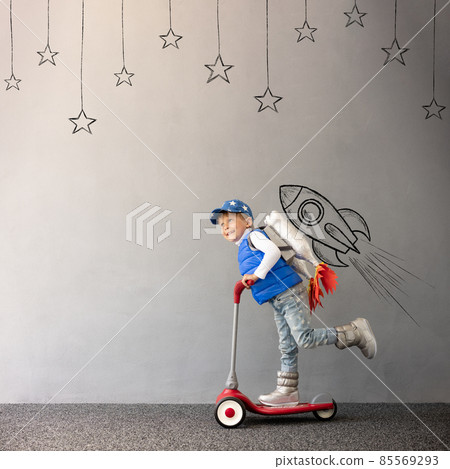 Happy child playing toy rocket 85569293