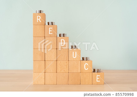 Building blocks and money labeled "REDUCE" Building blocks and money labeled "REDUCE" 85570998