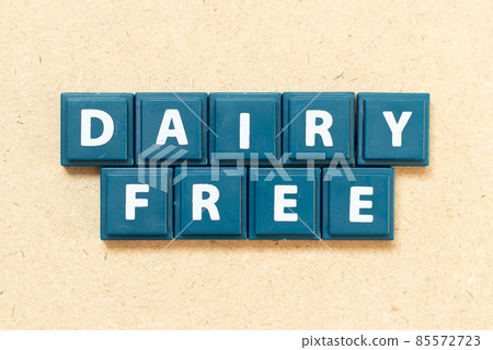 Tile alphabet letter in word dairy free on wood background Tile alphabet letter in word dairy free on wood background 85572723