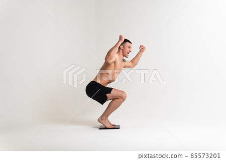 Man with weights health pondered, health and sports on a white background pain body backache spine isolated young stress, human holding. Tension lumbar therapy, lower suffer attractive Man with weights health pondered, health and sports on a white background pain body backache spine isolated young stress, human holding. Tension lumbar therapy, lower suffer attractive 85573201