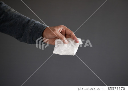 drug addiction concept with hand holding heroine packet on black backgrund drug addiction concept with hand holding heroine packet on black backgrund 85573370