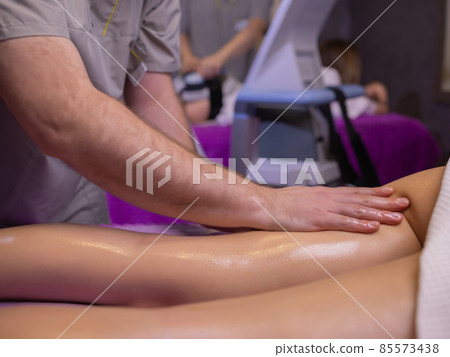 relaxing pain. fabulous full foot massage.close up side view cropped photo. relaxing pain. fabulous full foot massage.close up side view cropped photo. 85573438