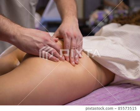 relaxing pain. fabulous full foot massage.close up side view cropped photo. 85573515