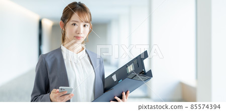 Portrait banner of a young business woman standing in the office corridor Shooting cooperation "LINK FOREST" Portrait banner of a young business woman standing in the office corridor Shooting cooperation "LINK FOREST" 85574394