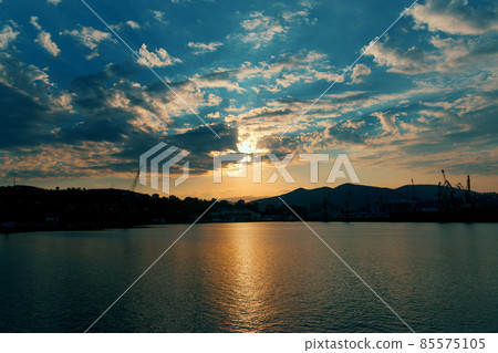 Morning dawn in port harbor. Calm sea in bay before dawn. Colorful harbor background. Dramatic sky Morning dawn in port harbor. Calm sea in bay before dawn. Colorful harbor background. Dramatic sky 85575105