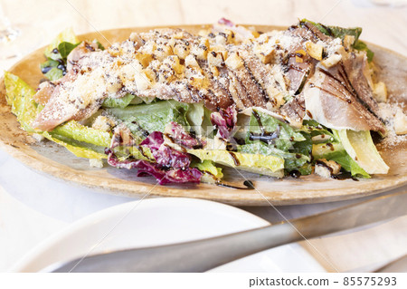 Caesar salad with delicious prosciutto 85575293