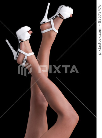 Beautiful legs of an young woman, in fishnet stockings 85575476