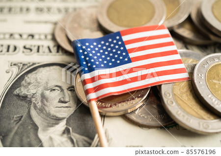 Stack of coins with USA America flag on dollar banknotes. Stack of coins with USA America flag on dollar banknotes. 85576196