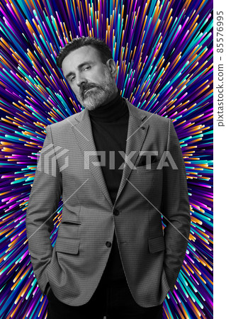 Portrait of a stylish elegant senior businessman with a beard and casual business clothes in photo studio isolated on dark background gesturing with hands Portrait of a stylish elegant senior businessman with a beard and casual business clothes in photo studio isolated on dark background gesturing with hands 85576995