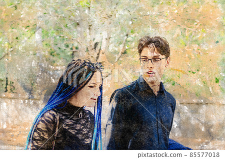 A young heterosexual couple in love walks through a chestnut alley. 85577018