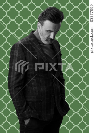 Black and white portrait of a stylish elegant senior businessman with a beard and casual business clothes against retro colorful pattern design background gesturing with hands Black and white portrait of a stylish elegant senior businessman with a beard and casual business clothes against retro colorful pattern design background gesturing with hands 85577099
