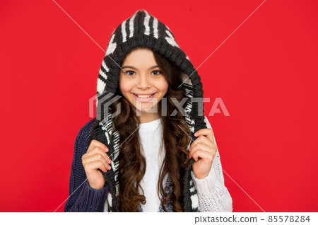emotional kid with curly hair in knitwear. teen girl on red background. emotional kid with curly hair in knitwear. teen girl on red background. 85578284