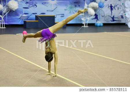 Girl competes in rhythmic gymnastics Girl competes in rhythmic gymnastics 85578511