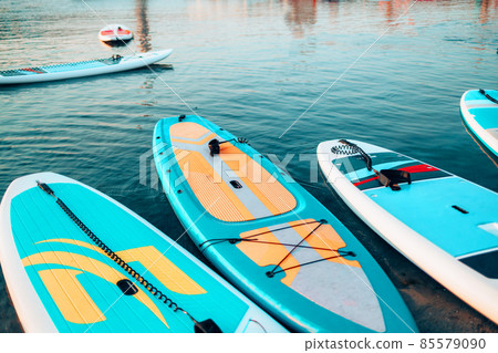 SUP Stand up paddle board on the background blue water. 85579090