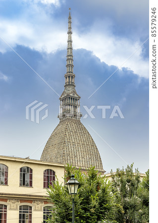 Turin, Mole Antonelliana building in Turin, Italy, street lamp in the foreground. Turin, Mole Antonelliana building in Turin, Italy, street lamp in the foreground. 85579246