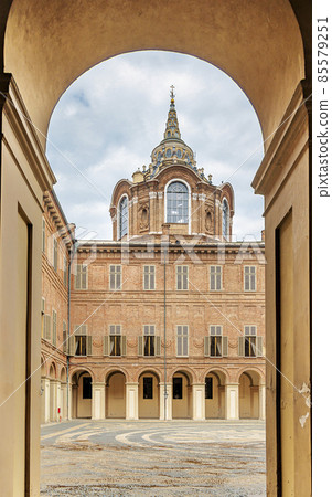 Turin, Italy, View of the courtyard of the Royal Palace of Savoy and the Chapel of the Holy Shroud through the arch. Turin, Italy, View of the courtyard of the Royal Palace of Savoy and the Chapel of the Holy Shroud through the arch. 85579251