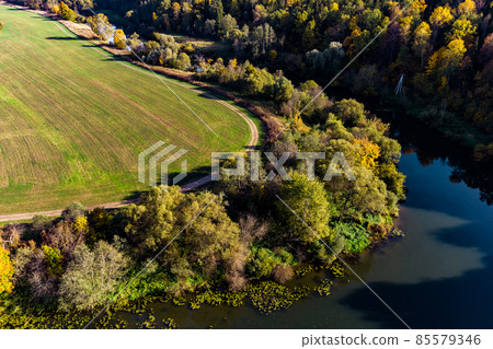 Landscape with a view of a river bend overgrown with trees, a picturesque autumn view of nature. Protva River, Kaluzhskiy Region, Russia 85579346
