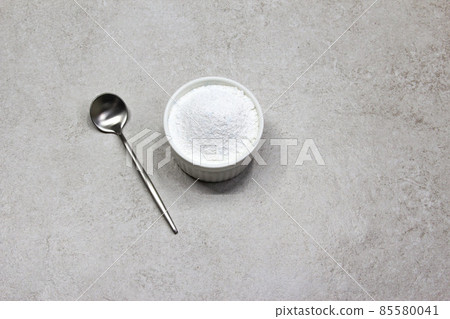 Collagen powder on grey beton background. Natural health supplement for skin 85580041